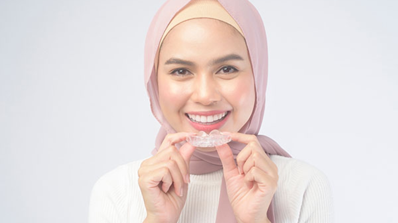 The Road to a Perfect Smile: Invisalign Aligners vs. Invisible Braces